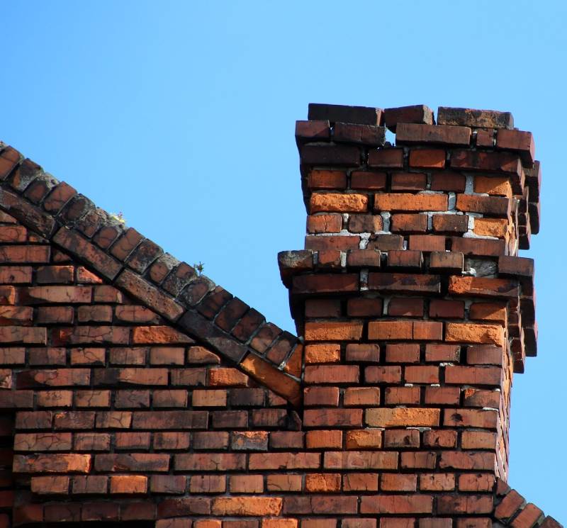 Signs Your Plymouth Home Needs a Chimney Inspection Damaged chimney on an Plymouth home showing cracks and missing mortar